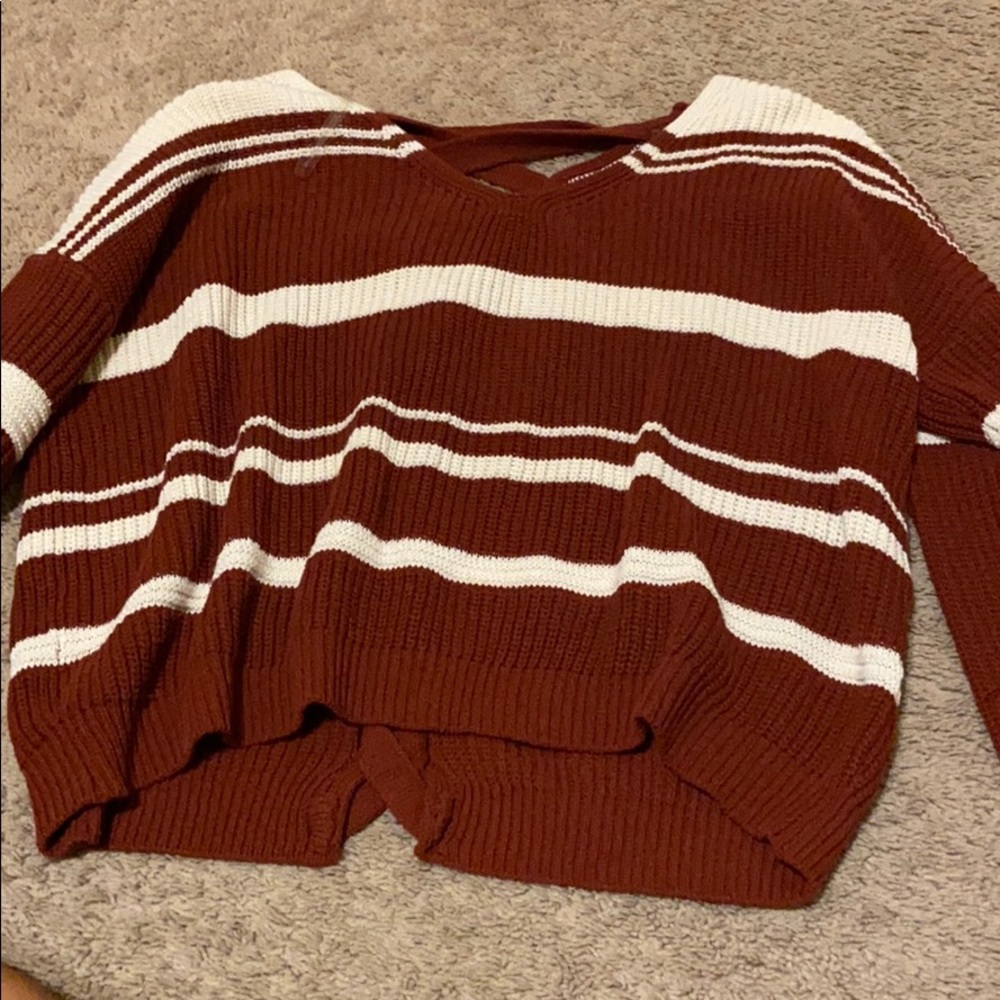red and white sweater with braided back